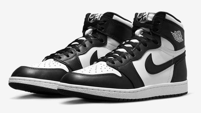 Side view of black and white Air Jordan sneakers.